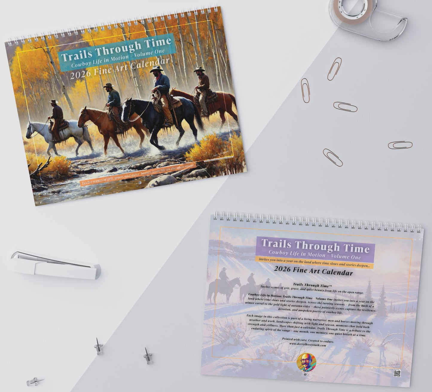2023 Fine Art Calendar titled 'Trails Through Time' on a white surface with paper clips.