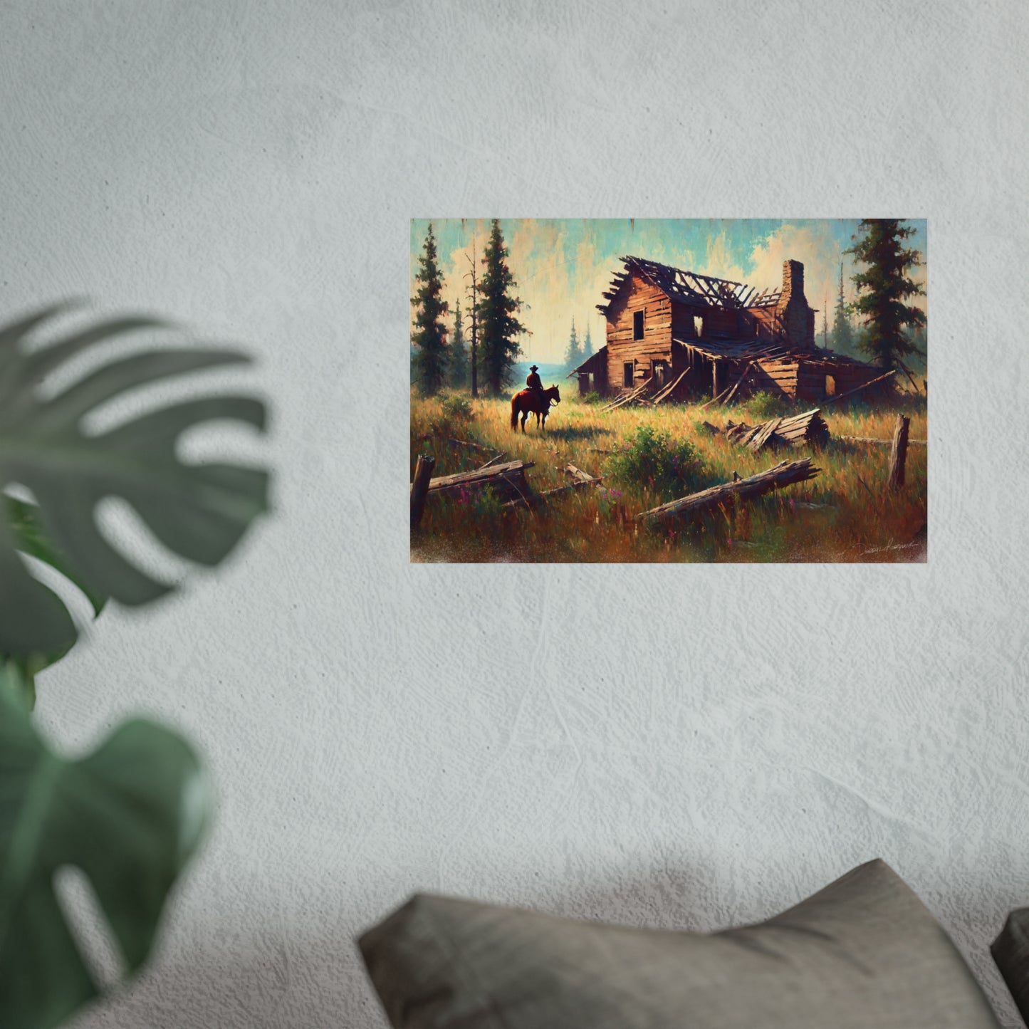 Poster of a landscape with a cowboy on horseback near a wooden cabin on a wall.