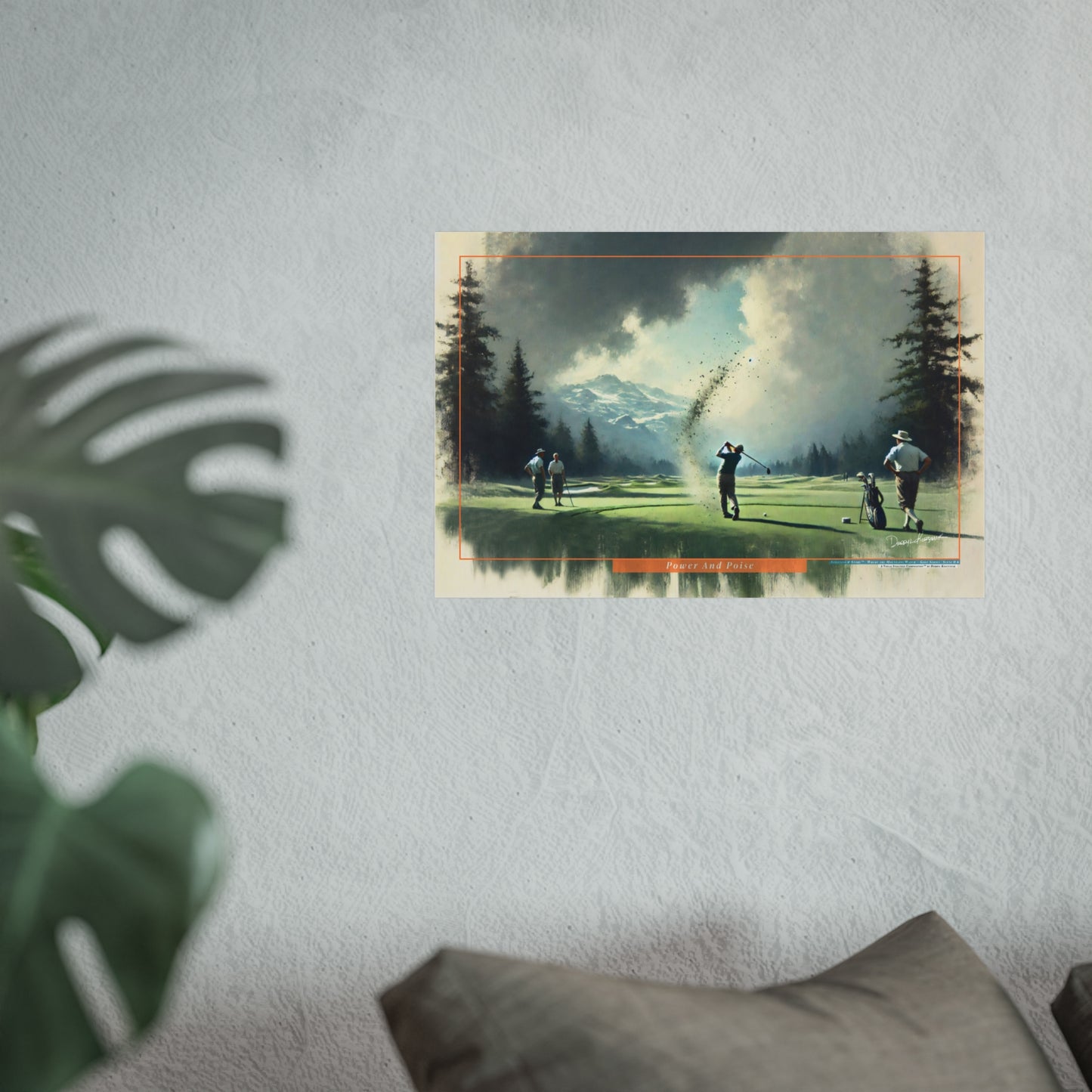 Poster of a golf scene on a wall with a plant and pillow in the foreground