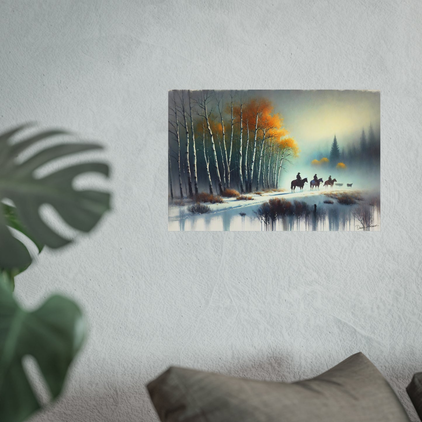 Framed painting of a forest scene with trees and cowboys on a wall.