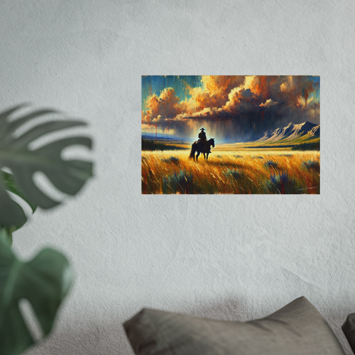 Painting of a cowboy on horseback in a field with dramatic clouds, mounted on a wall.