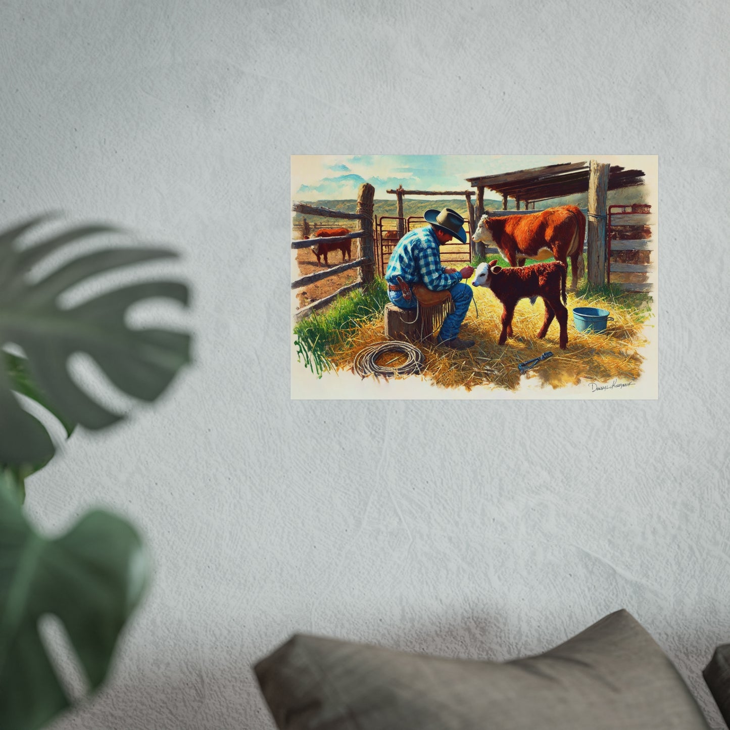 Art print of a cowboy with a calf in a barn setting on a wall.