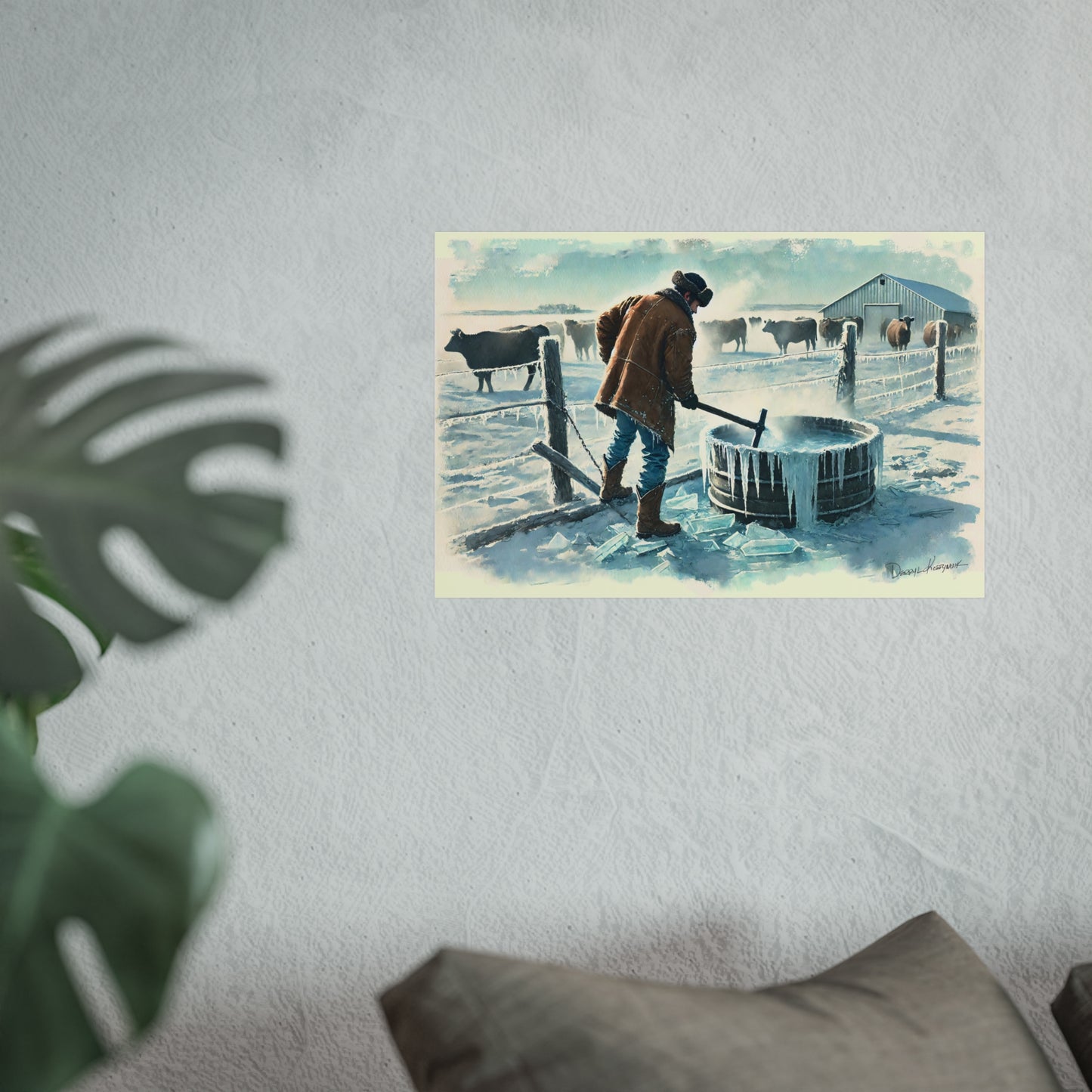 Framed artwork of a Cowboy near a fence and cows on a snowy day, displayed on a wall.