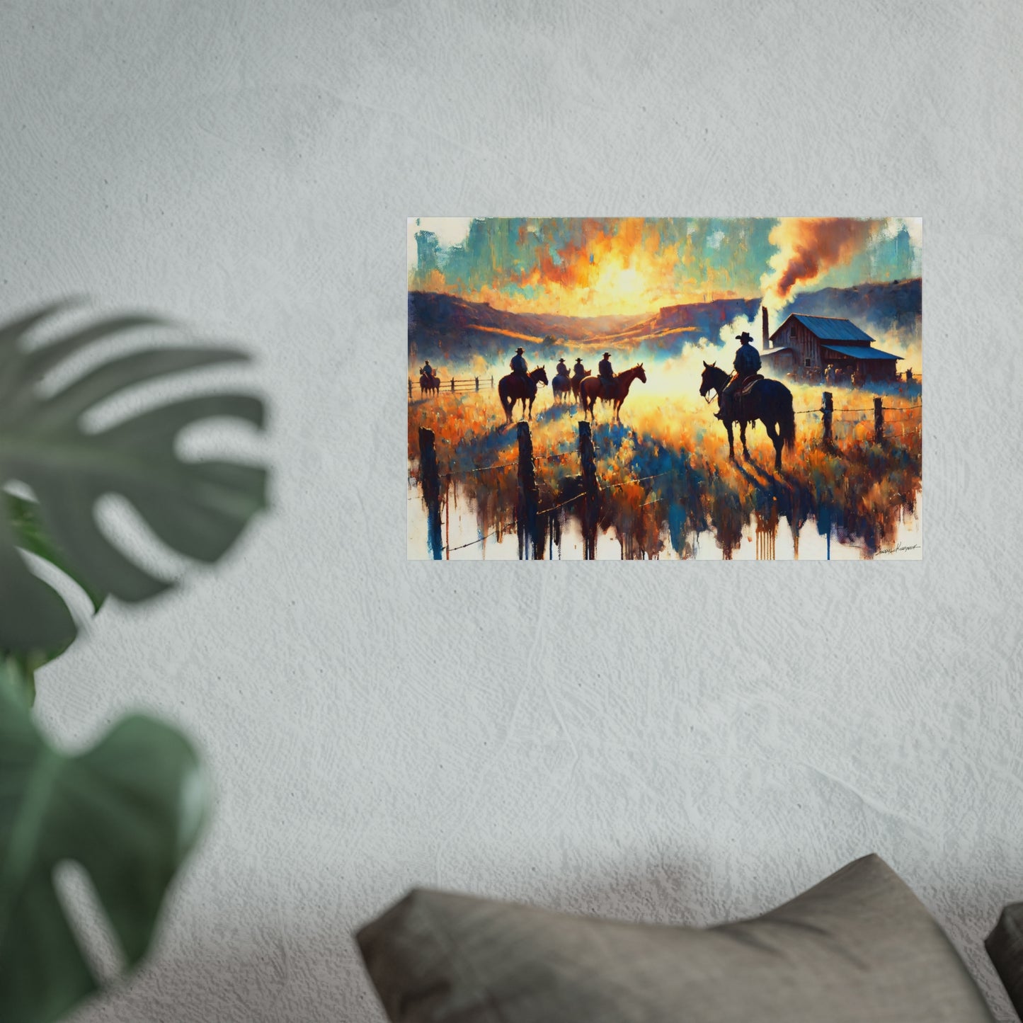 Painting of a rural scene with cowboys on horses against a sunset sky, displayed on a wall.