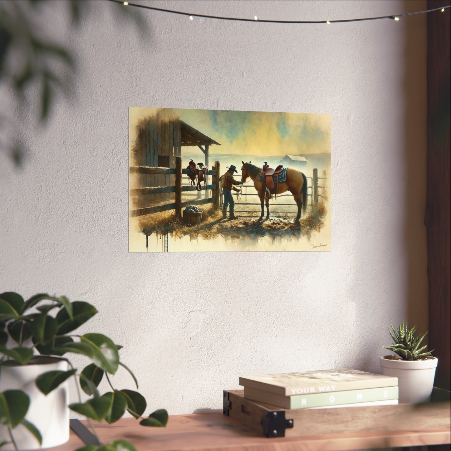Painting of a rustic scene with cowboy and a horse on a wall above a wooden desk.
