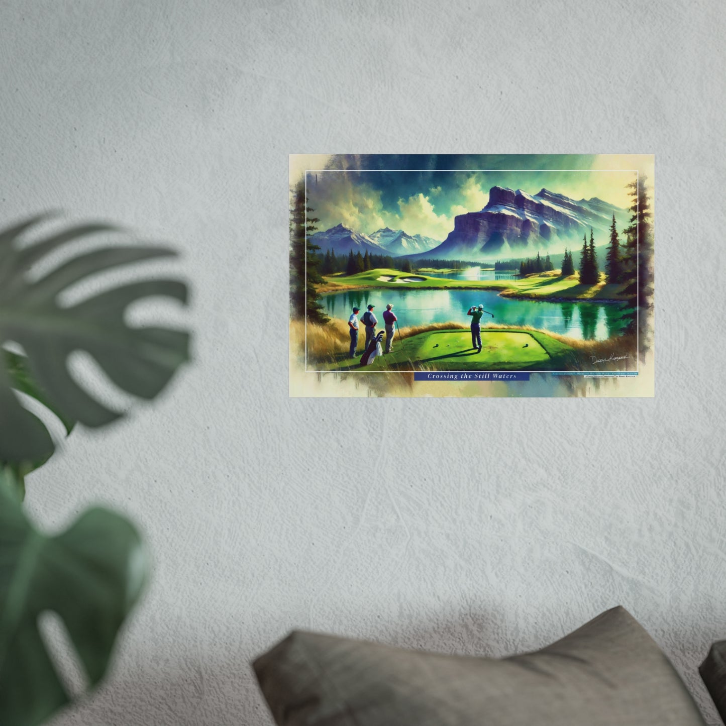 Framed artwork of a golf course with mountains on a wall.