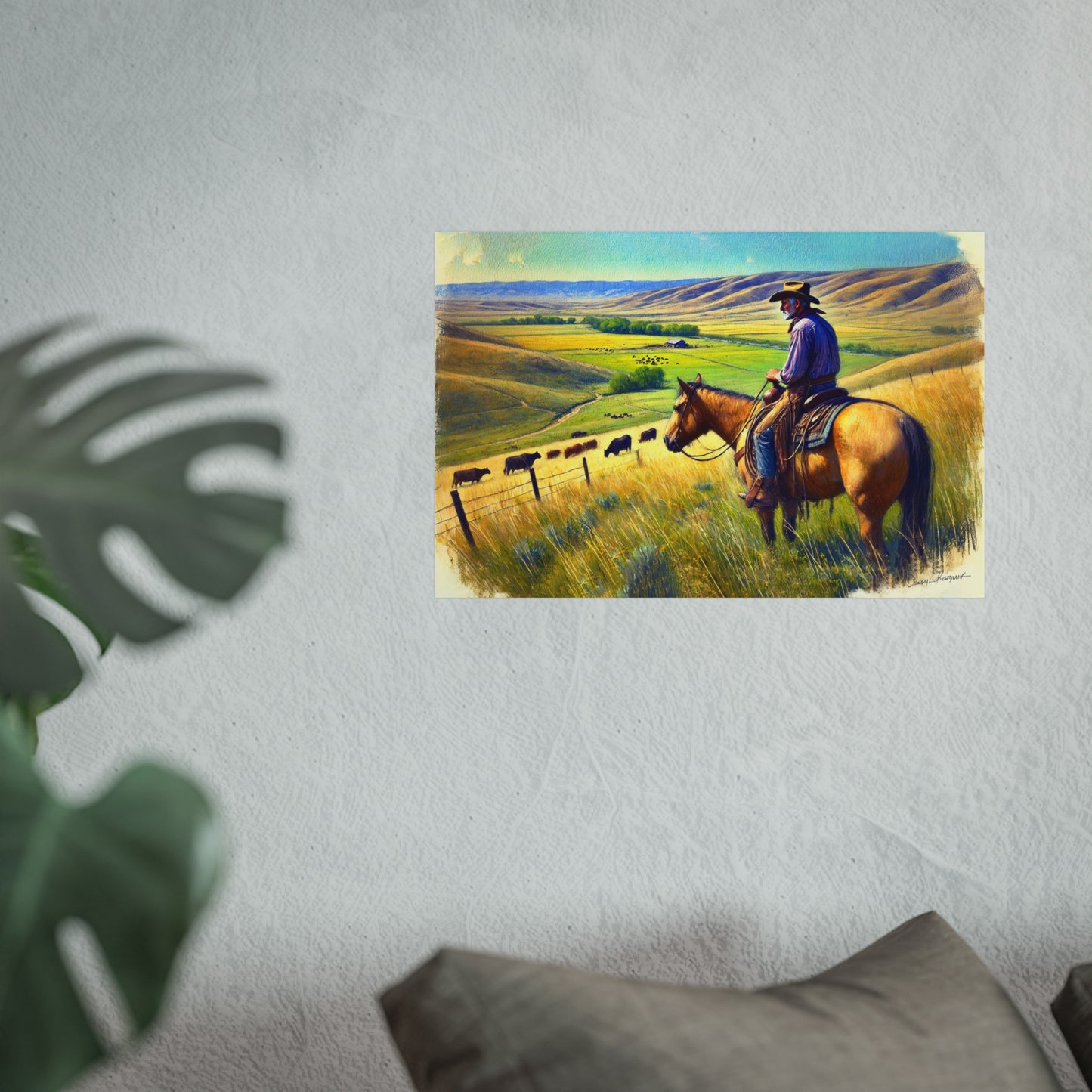 Poster of a cowboy on a horse in a field with hills in the background, mounted on a wall.