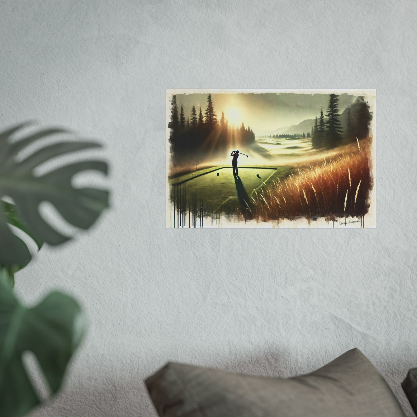 Giclee print of a golf player on a golf course with trees and sunset on the wall.