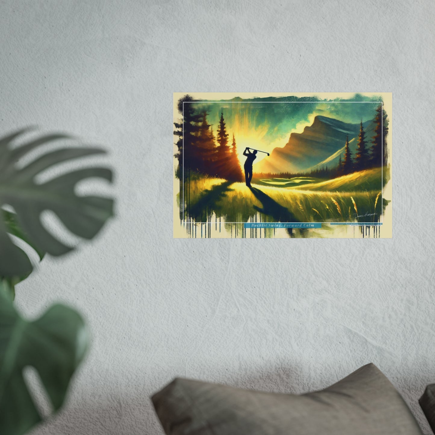 Framed artwork of a golf player on a mountain course on a textured wall.