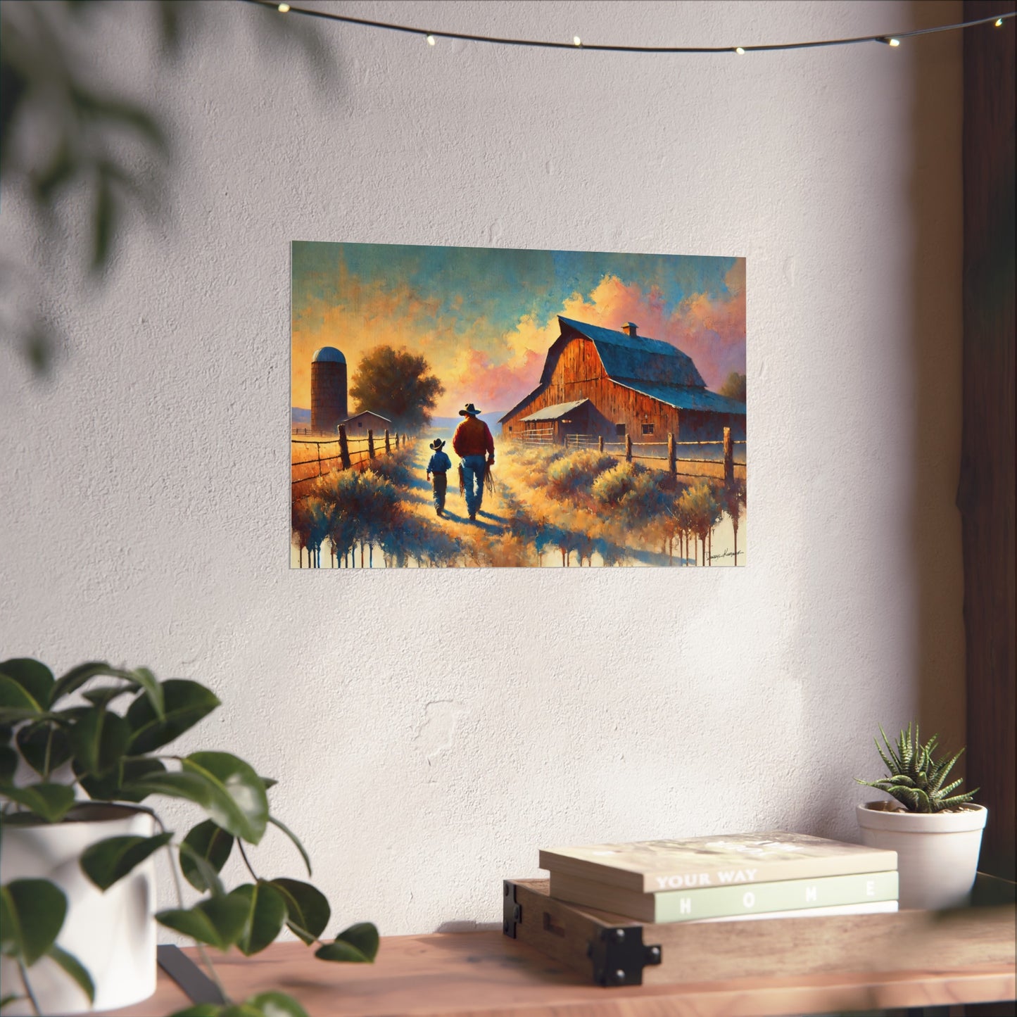 Painting of two cowboys walking towards a barn on a wall above a desk with plants.
