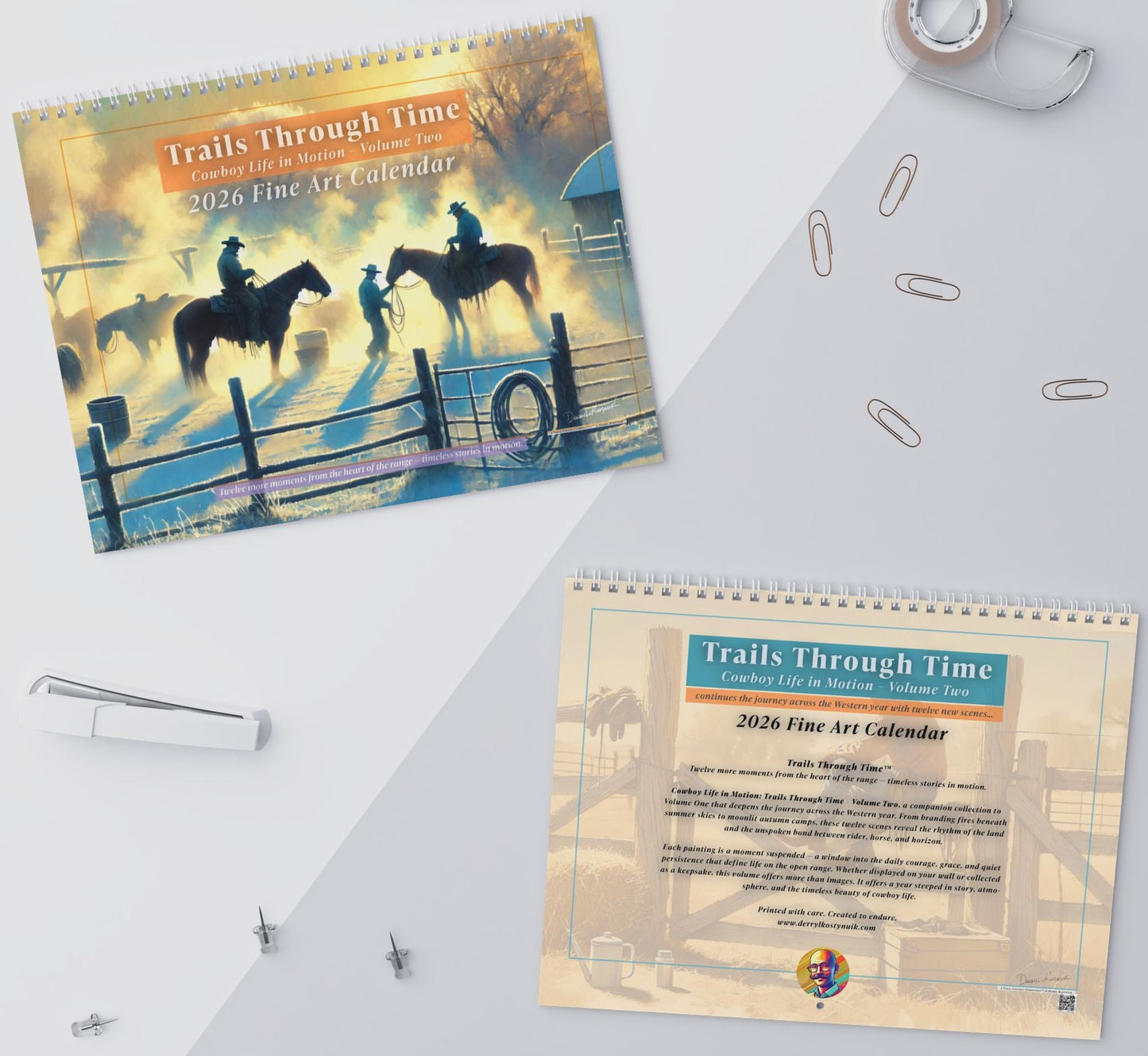 2023 Fine Art Calendar titled 'Trails Through Time' on a white surface with office supplies.