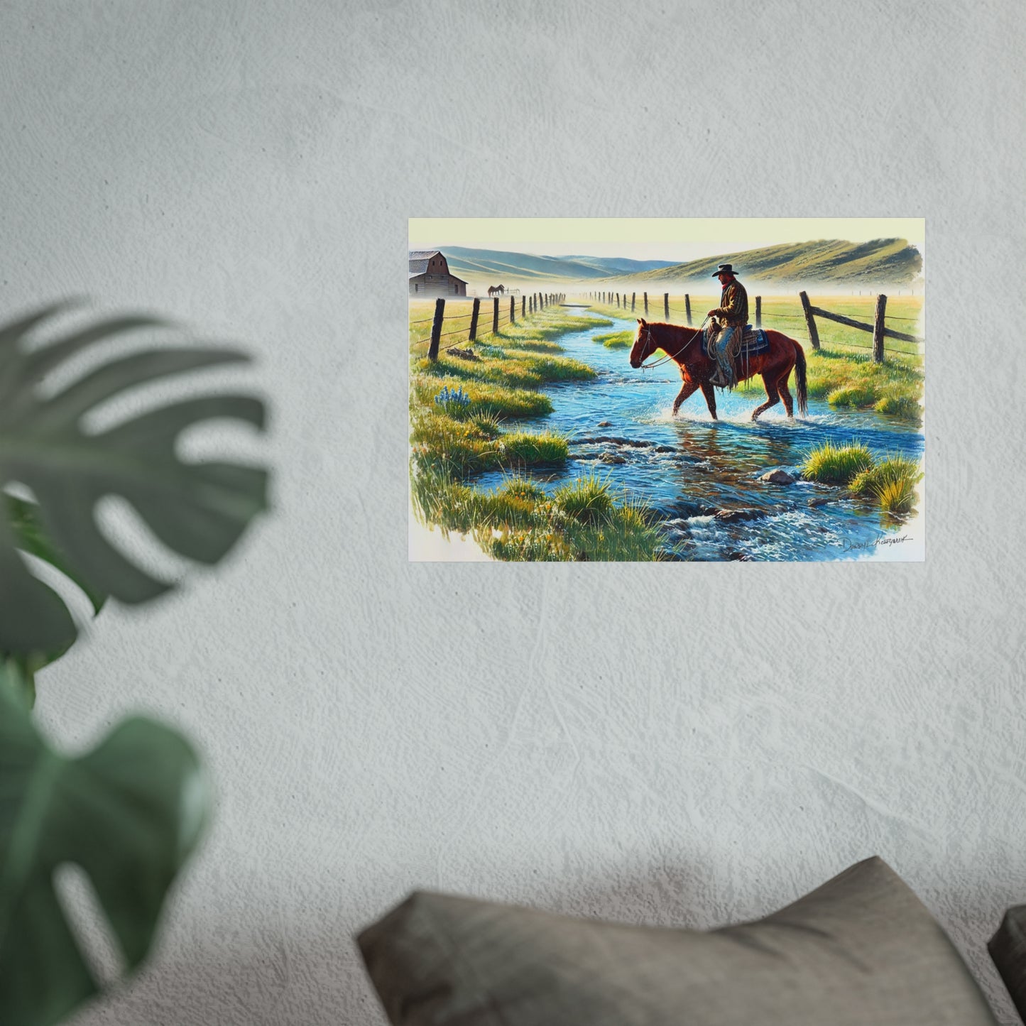 Poster of a cowboy on a horse crossing a stream in a scenic landscape, placed on a wall.
