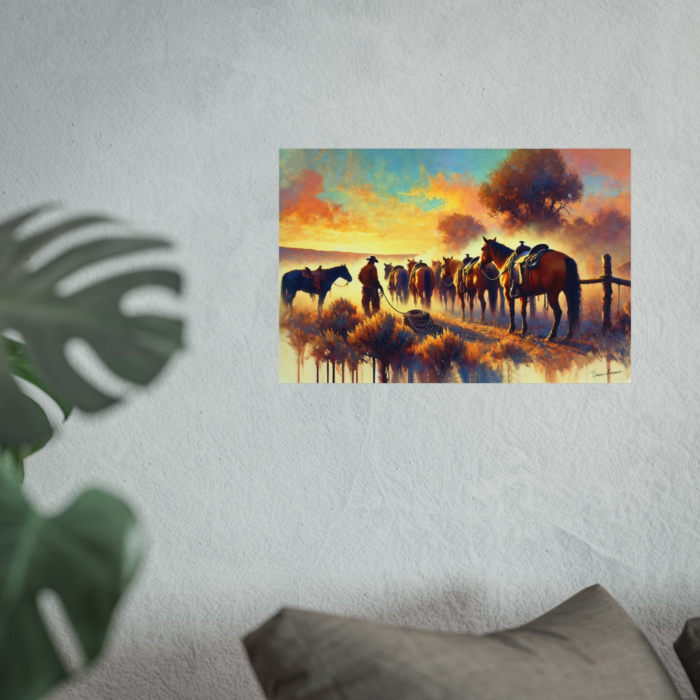 Painting of a cowboy with horses against a sunset sky on a wall.