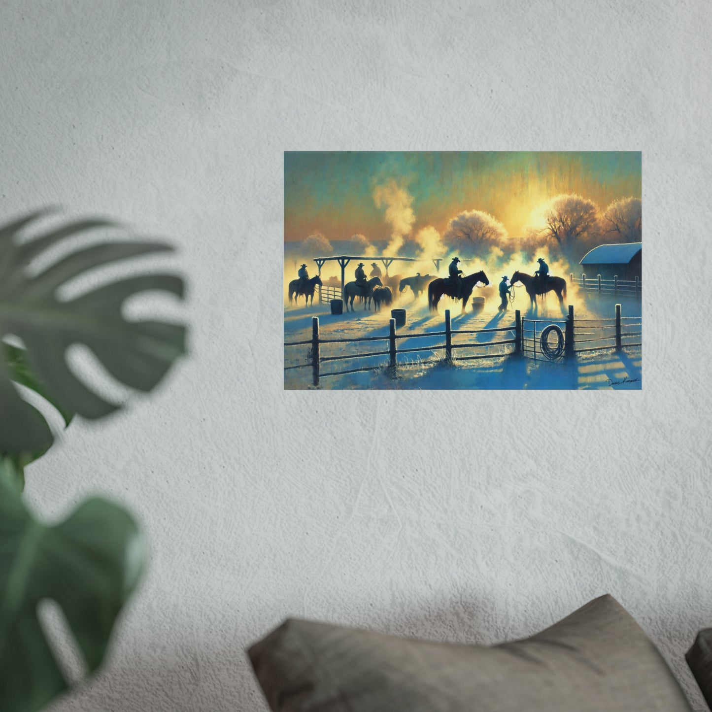 Art print of a sunset scene with cowboys on horses in a field, hanging on a wall.