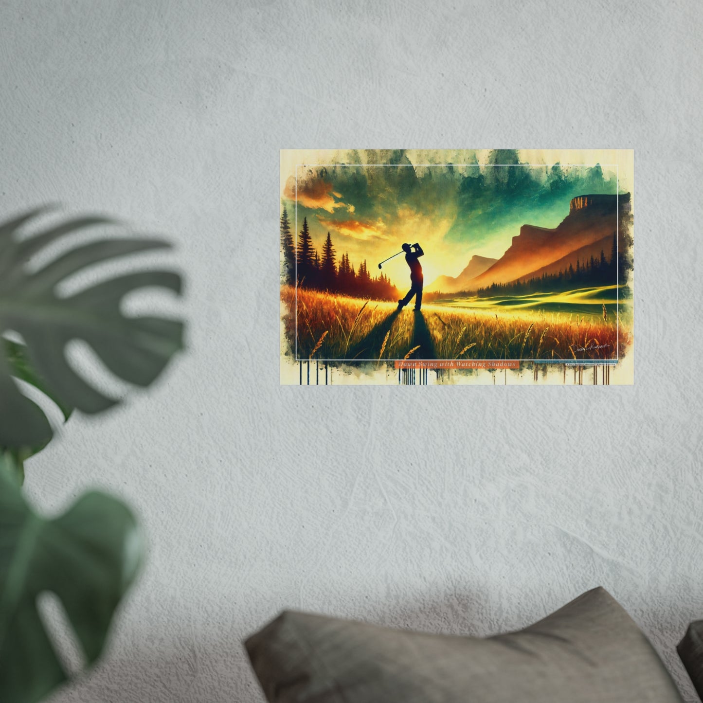 Giclee print of a golfer on a golf course with mountains in the background, displayed on a wall.