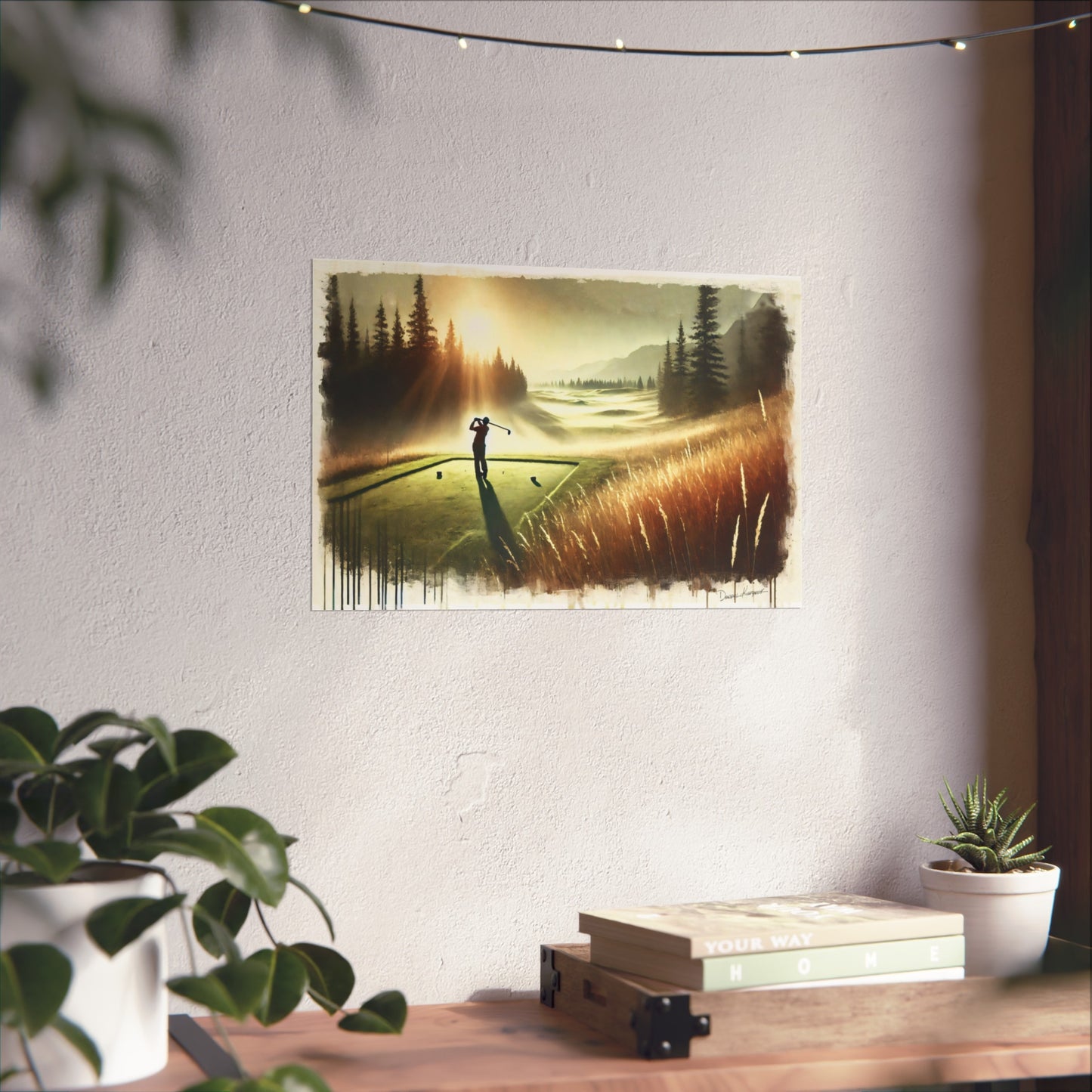 Giclee print of a golf scene on a wall above a desk with plants.